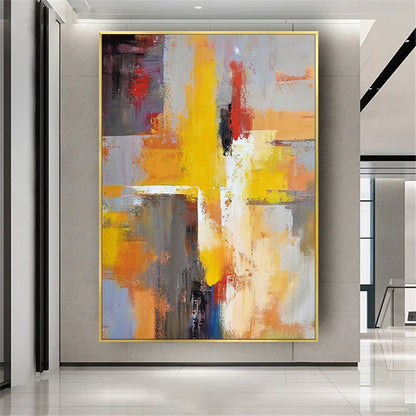 Room mockup showing bold yellow and orange strokes crossing grey and cream blocks with small red and black accents.