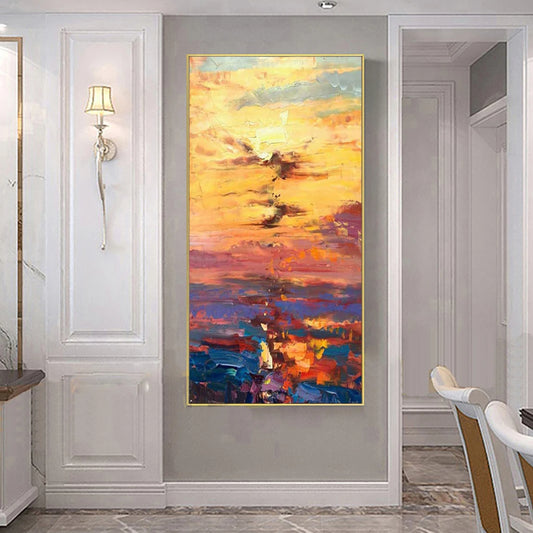 Room mockup showing broad yellow and orange sky strokes over purple, red and deep blue water with a bright central reflection.