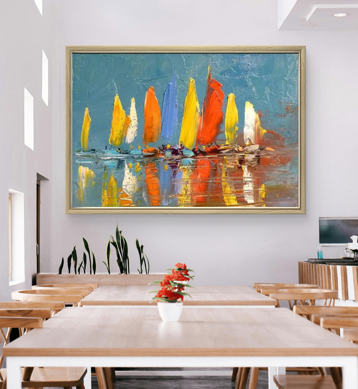 Room mockup. A row of boats with bright yellow, orange and white sails reflected in muted blue-grey water.