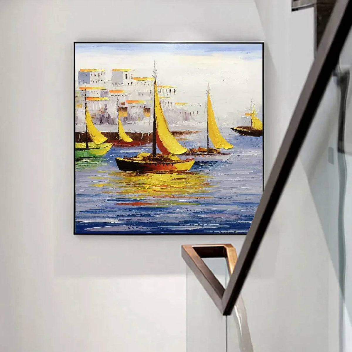 Room mockup. Yellow sails and dark boat hulls reflected in blue water beside pale waterfront buildings with warm yellow accents.