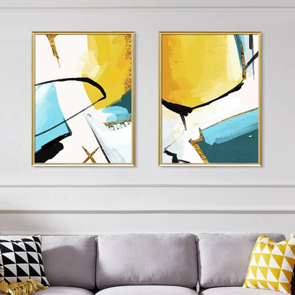 Room mockup showing two abstracts with bold yellow, teal and white fields crossed by sweeping black lines.
