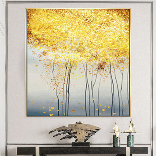 Room mockup. Slender dark trunks rise into a dense yellow and gold-coloured canopy above pale grey, with scattered fallen leaves.