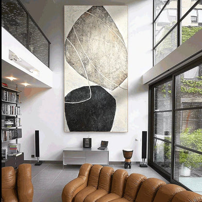 Room mockup. A large tilted beige rounded shape floats above a smaller black form, crossed by fine pale curves on cream.
