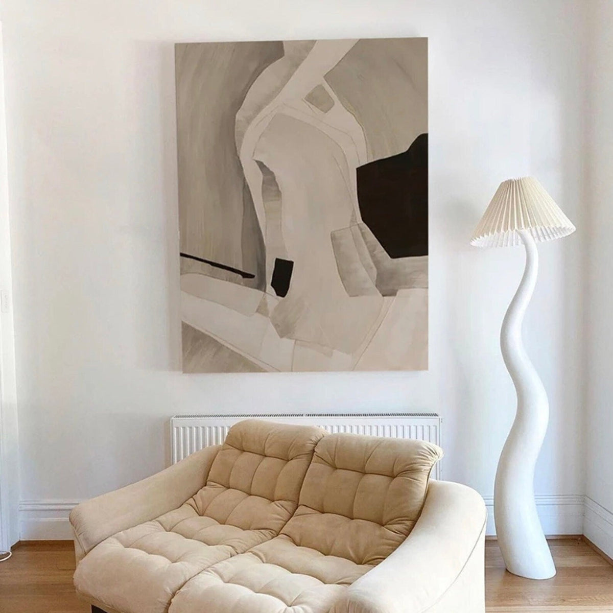 Room mockup. Soft cream and taupe curved bands surround a dark brown angular patch and a small black block.