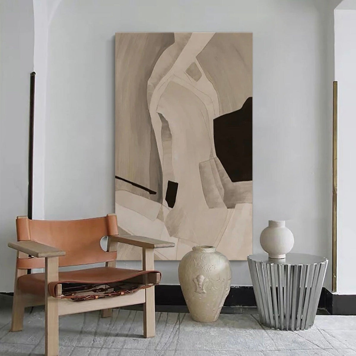 Room mockup. Soft cream and taupe curved bands surround a dark brown angular patch and a small black block.