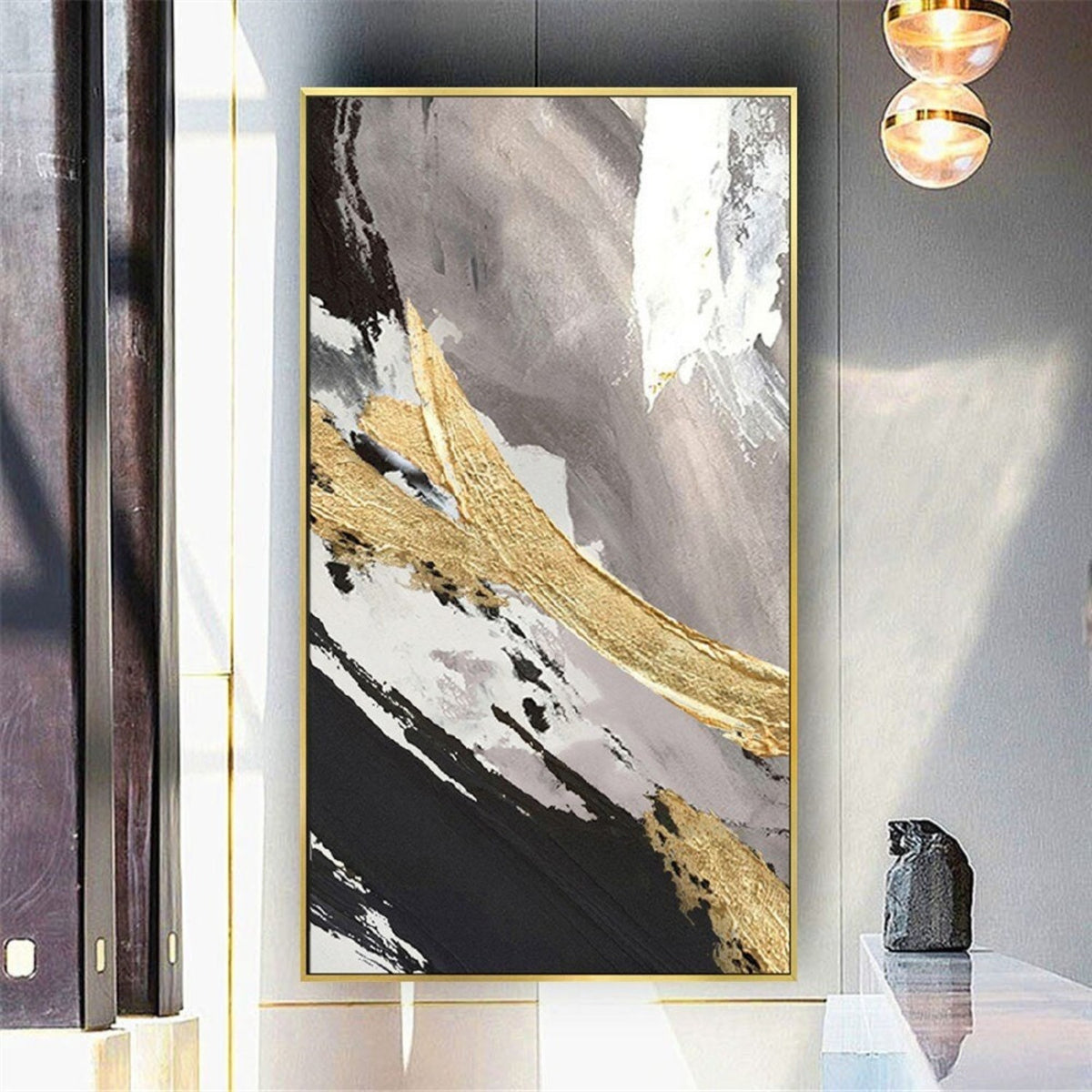 Room mockup. Broad diagonal black, white and muted grey strokes crossed by a thick rough gold-coloured sweep.