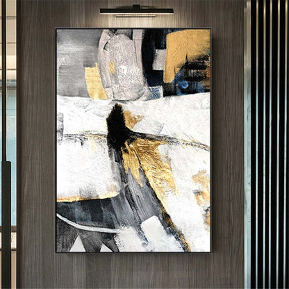 Room mockup. Black, grey and white angular shapes with gold-coloured patches suggest an elongated abstract figure.