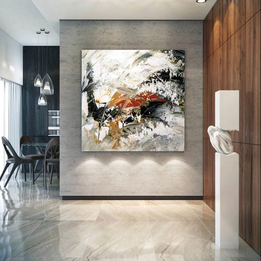 Room mockup. Broad black and white textured strokes with rust-red and ochre accents in a swirling abstract composition.