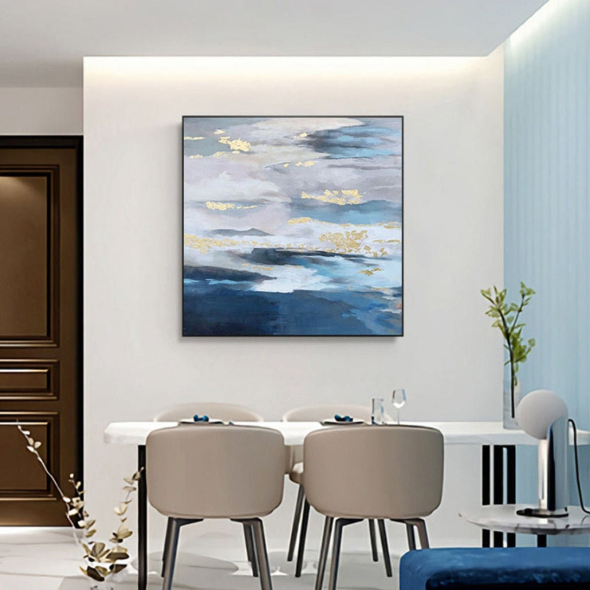 Room mockup. Layered blue, grey and white cloud-like bands with scattered gold-coloured patches above deep blue lower strokes.