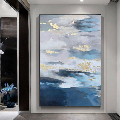 Room mockup. Layered blue, grey and white cloud-like bands with scattered gold-coloured patches above deep blue lower strokes.