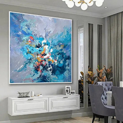 Room mockup showing blue and lavender abstract with a concentrated burst of turquoise, white, red and orange marks near the centre.