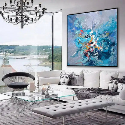 Room mockup showing blue and lavender abstract with a concentrated burst of turquoise, white, red and orange marks near the centre.