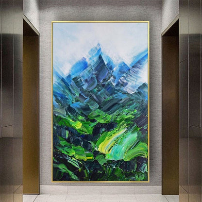 Room mockup. Angular blue mountain peaks rise above a vivid green valley with sweeping textured green and turquoise strokes.