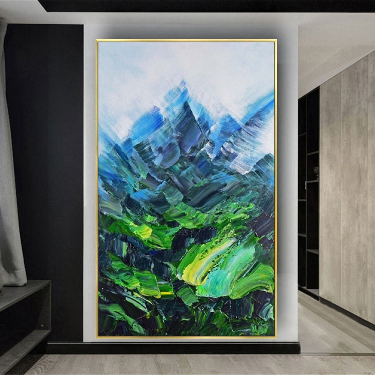 Room mockup. Angular blue mountain peaks rise above a vivid green valley with sweeping textured green and turquoise strokes.