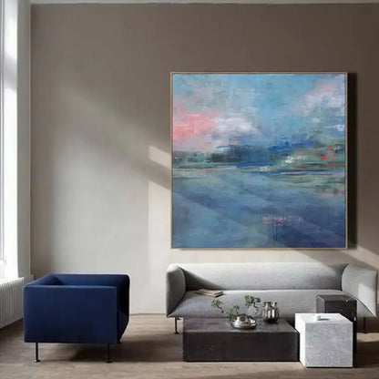 Room mockup showing soft blue water-like fields beneath pink and blue clouds, with a distant green and dark blue horizon.