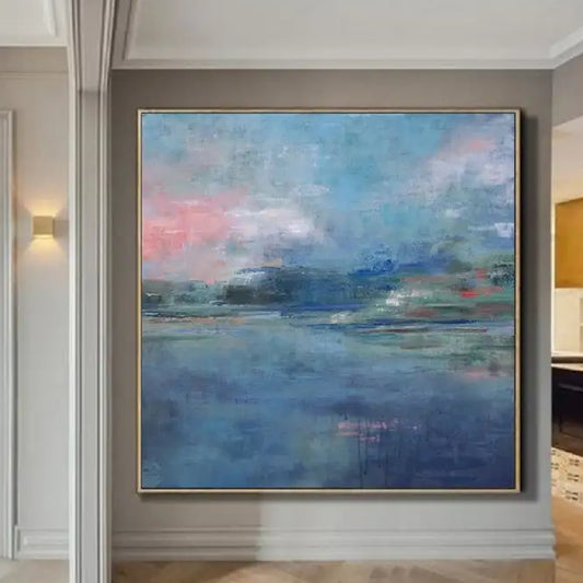 Room mockup showing soft blue water-like fields beneath pink and blue clouds, with a distant green and dark blue horizon.