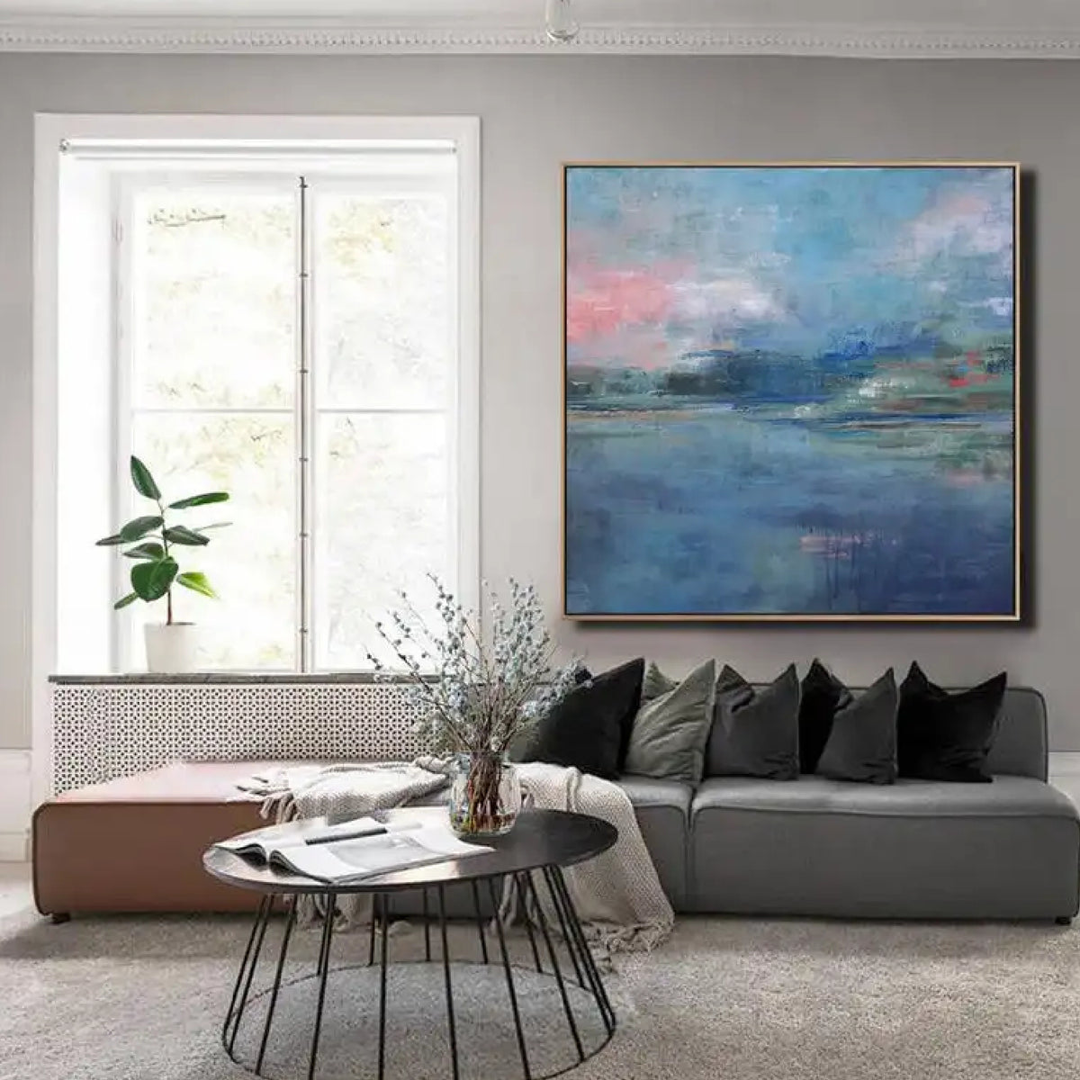 Room mockup showing soft blue water-like fields beneath pink and blue clouds, with a distant green and dark blue horizon.