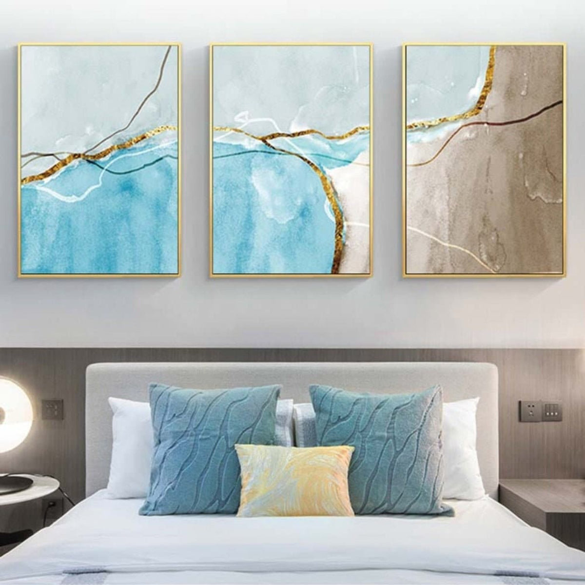 Room mockup. Three-panel artwork with pale blue, turquoise and taupe fields crossed by fine branching lines.