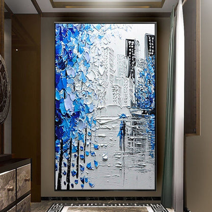 Room mockup. Thick blue and white tree-like marks frame grey city buildings and a small blue figure on a reflective street.