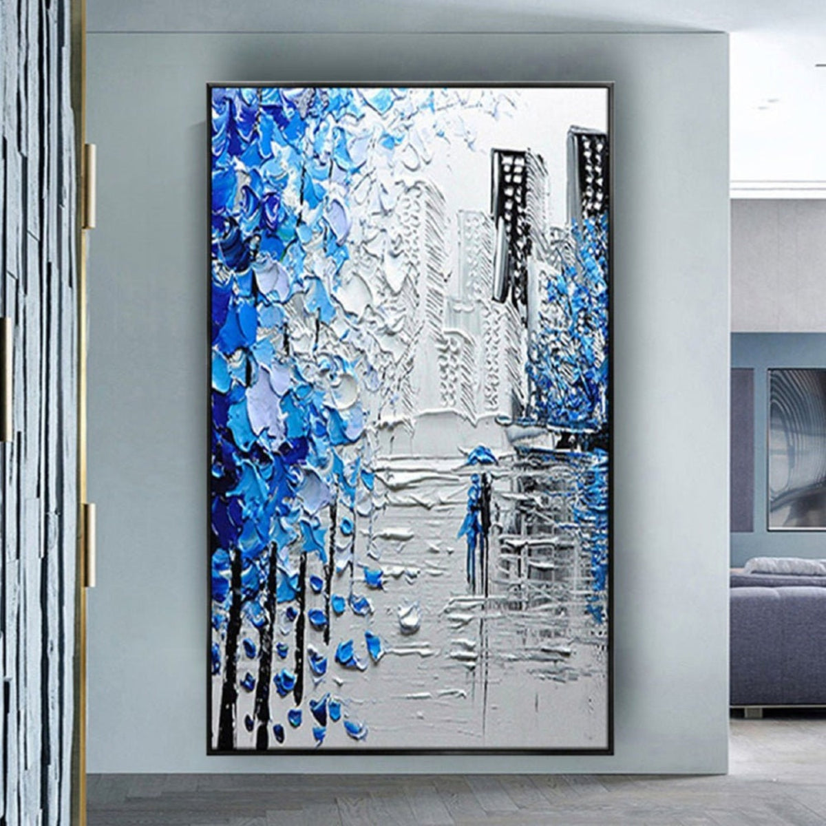 Room mockup. Thick blue and white tree-like marks frame grey city buildings and a small blue figure on a reflective street.