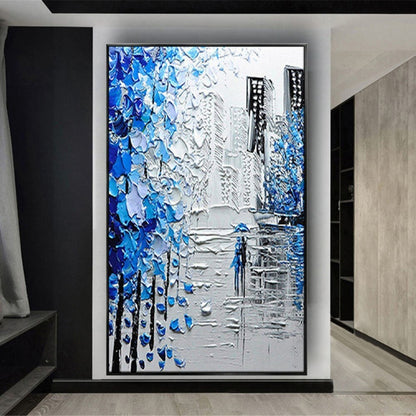 Room mockup. Thick blue and white tree-like marks frame grey city buildings and a small blue figure on a reflective street.