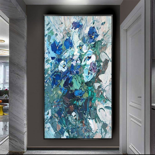 Room mockup. Dense blue and turquoise flower-like dabs with grey stems and white textured strokes on a pale ground.