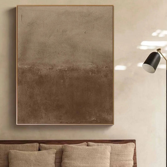 Room mockup showing soft mottled beige upper area blending into a deeper brown lower field with fine rough texture.
