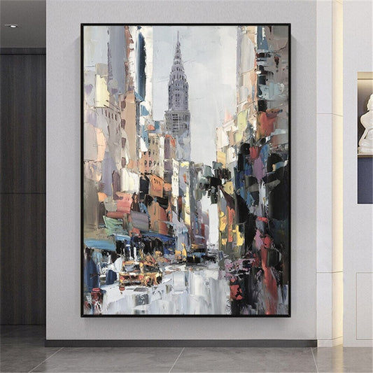 Room mockup. A busy street between tall grey and warm peach buildings leads toward a pointed skyscraper beneath a pale sky.