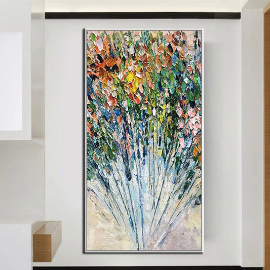 Room mockup. A dense bouquet of small pink, orange, yellow, green and blue textured dabs fans out above long fine blue stems.