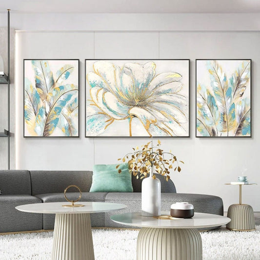 Room mockup. Three-panel artwork with a large cream flower and long pale blue, grey and gold-coloured petal shapes.