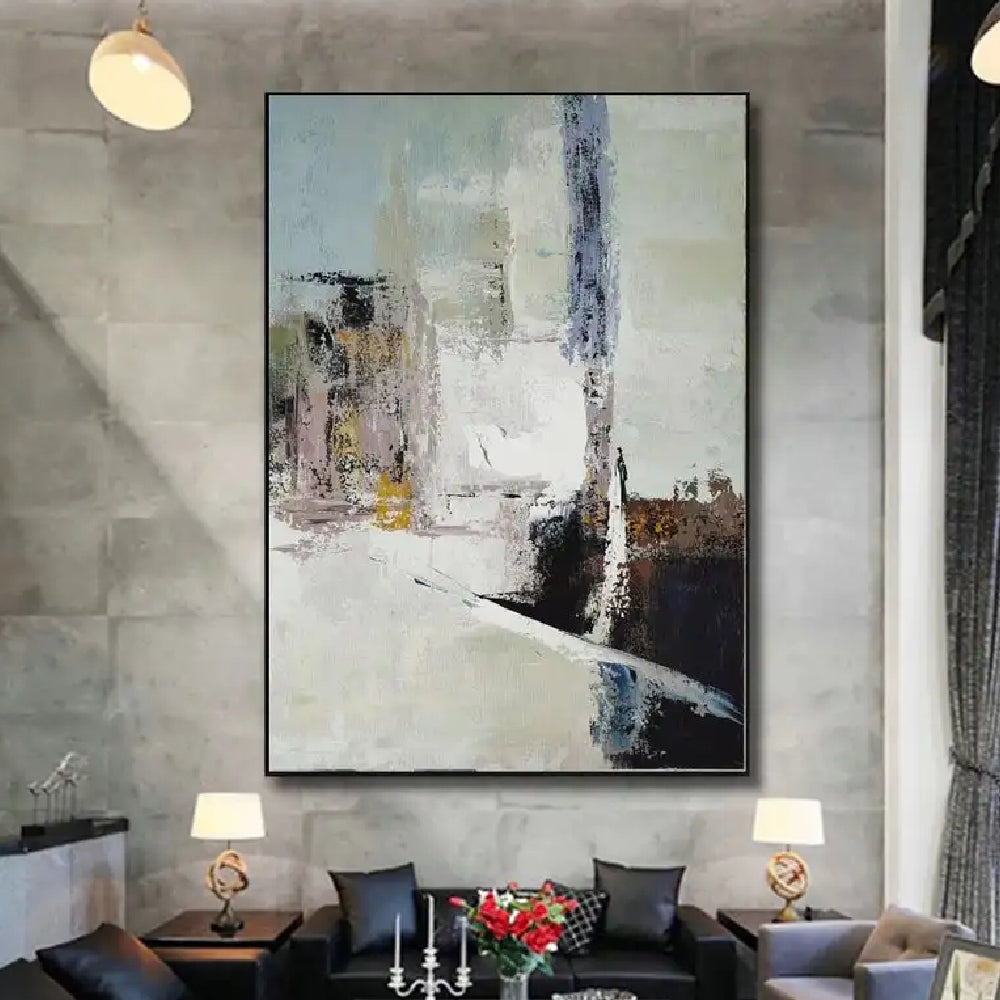 Room mockup showing cream abstract painting with pale blue-grey blocks, a tall dark streak and black and brown angular lower shapes.