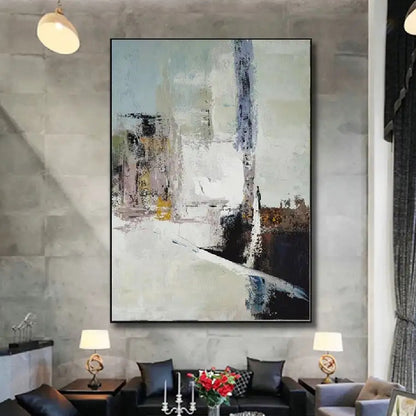 Room mockup showing cream abstract painting with pale blue-grey blocks, a tall dark streak and black and brown angular lower shapes.