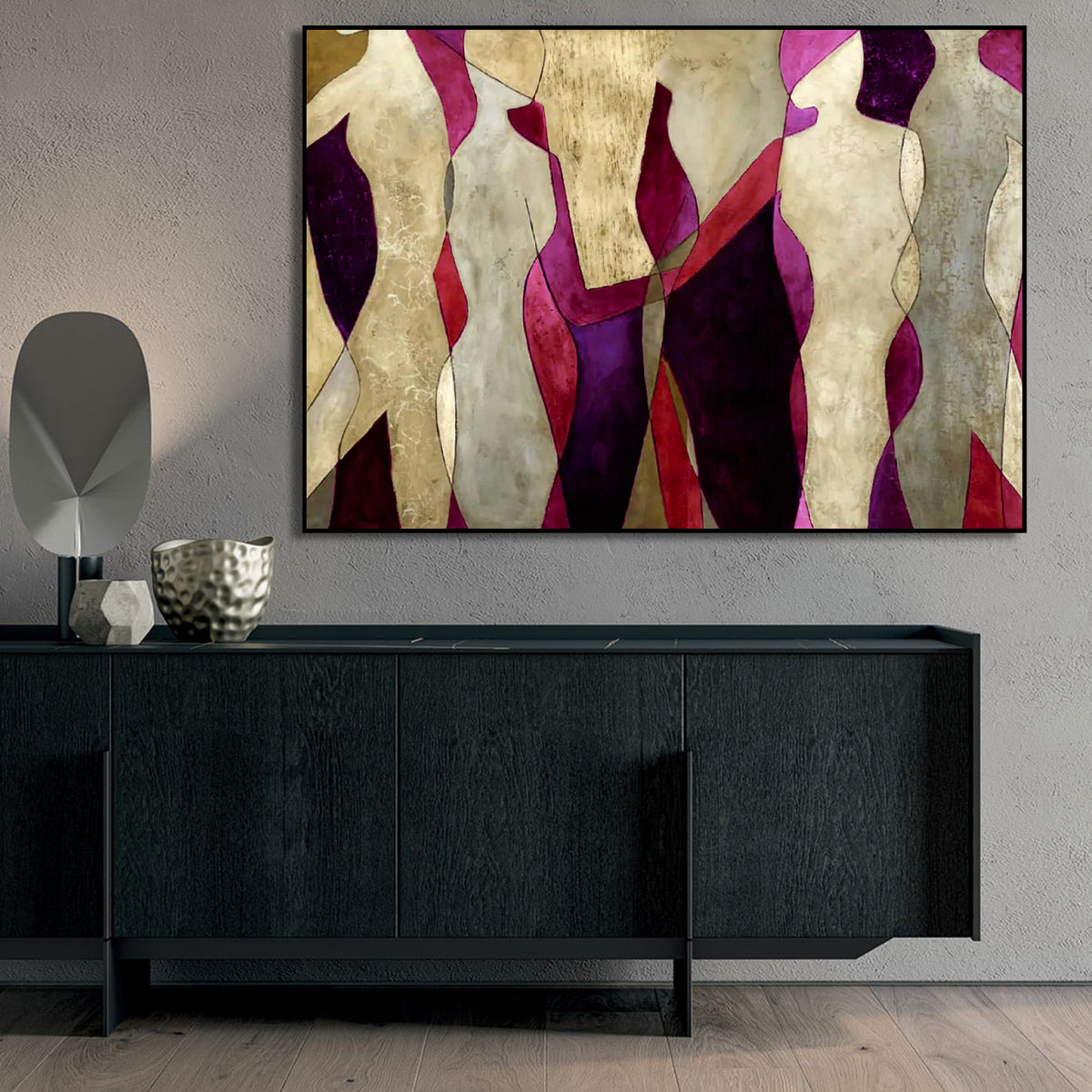 Room mockup showing cream abstract figures with angular bodies against burgundy, red and purple shapes.