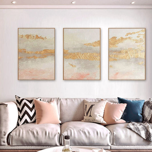Room mockup. Three-panel artwork with cream, grey and soft pink fields crossed by rough gold-coloured bands.
