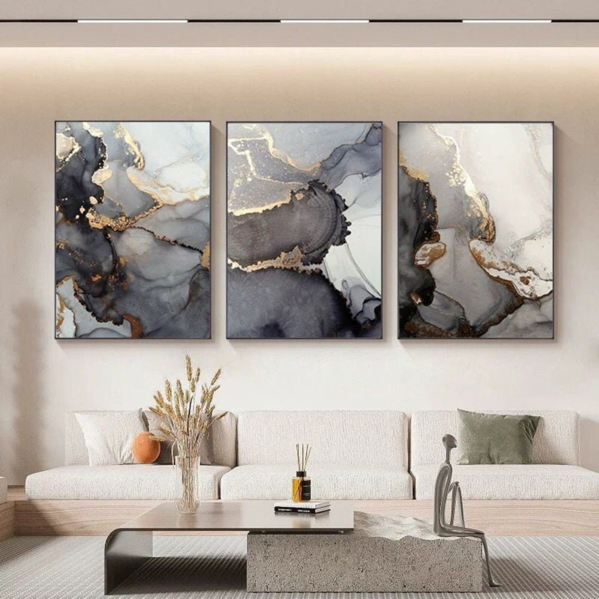Room mockup. Three-panel artwork with flowing cream, navy and grey fields edged by gold-coloured lines.