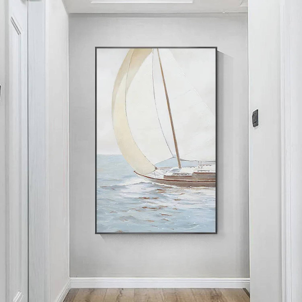 Room mockup. A small brown-hulled boat with a broad curved cream sail on pale blue-grey water beneath a soft white sky.