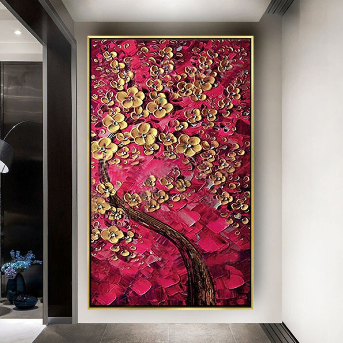 Room mockup. A dark curving tree trunk supports clusters of raised gold-coloured blossoms against dense red and crimson textured dabs.