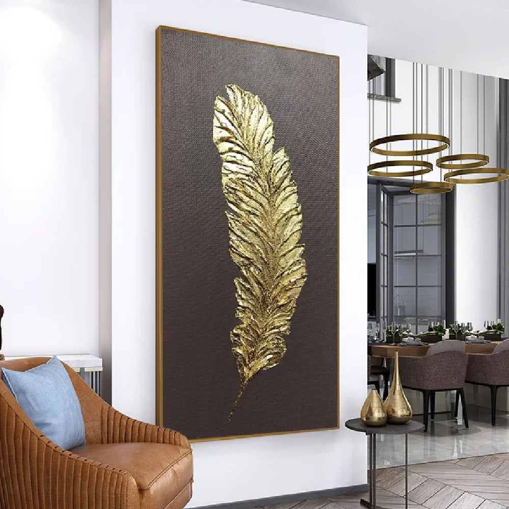 Room mockup showing single gold-coloured feather with layered raised barbs on a dark brown background.