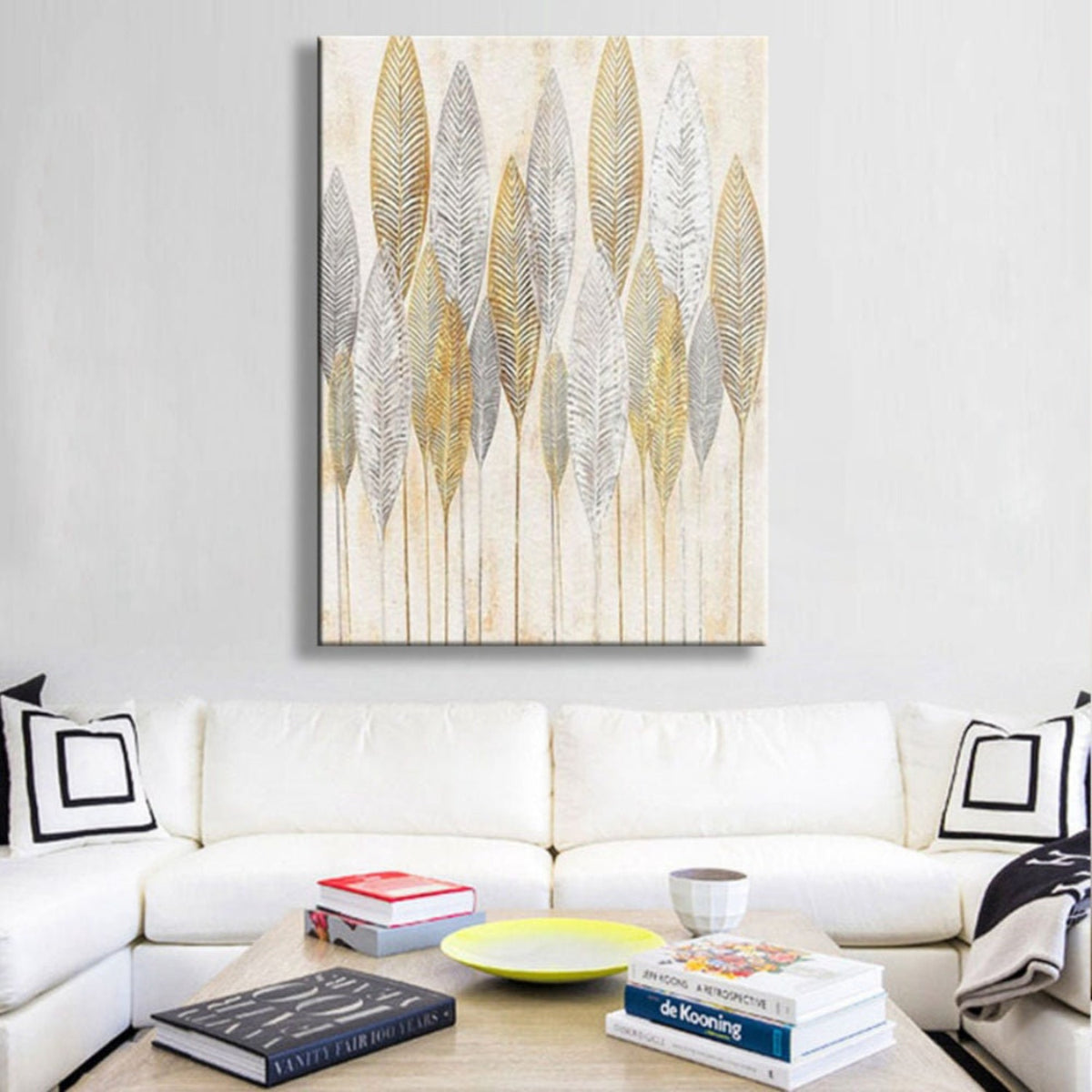 Room mockup. Tall slender gold-coloured and grey leaf skeletons with fine veins on pale cream, supported by thin stems.
