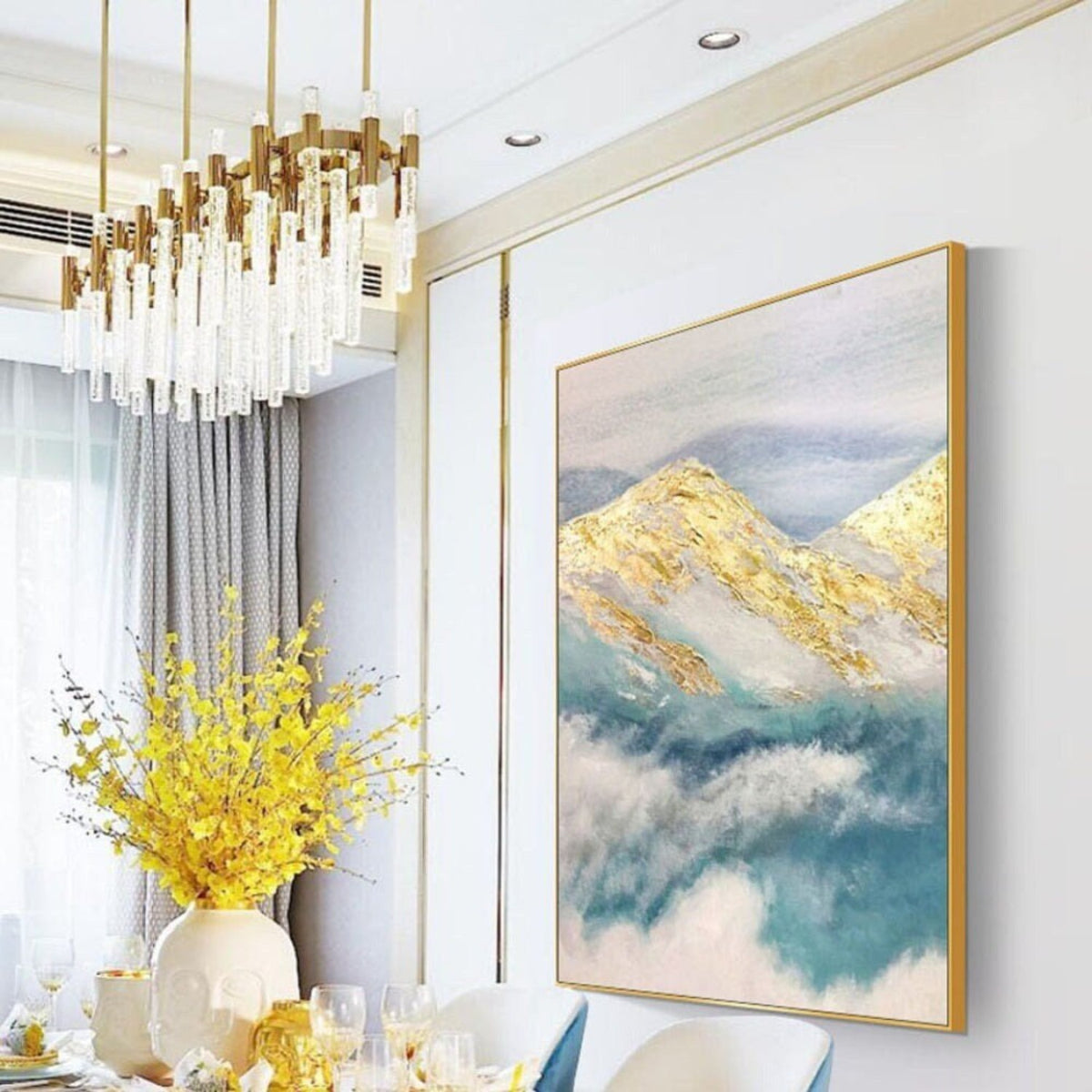 Room mockup. Gold-coloured mountain ridges rise above soft teal and white cloud-like strokes beneath a pale grey sky.