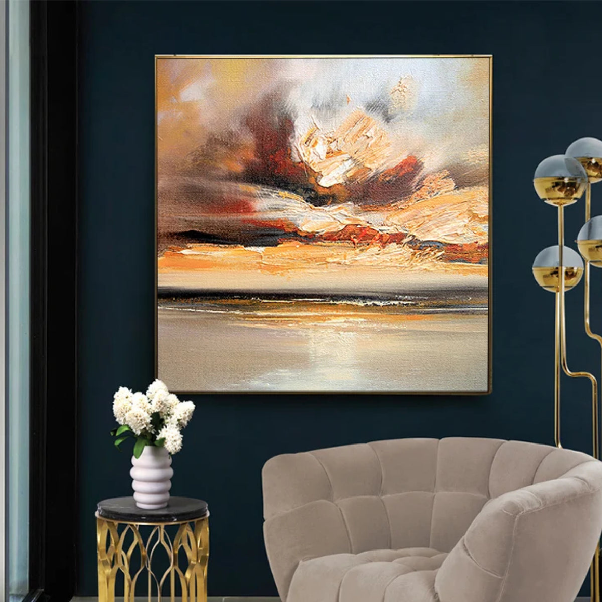 Room mockup showing cream, gold-coloured and orange cloud-like strokes above a dark horizontal horizon and pale reflective water.