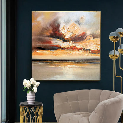 Room mockup showing cream, gold-coloured and orange cloud-like strokes above a dark horizontal horizon and pale reflective water.