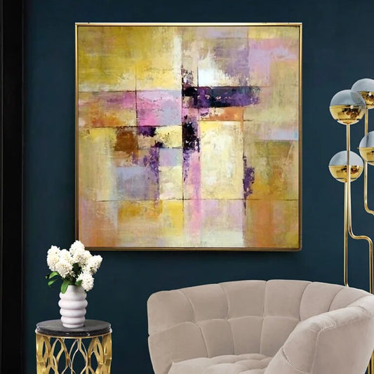 Room mockup showing layered geometric blocks in muted gold, cream, pink and purple with dark horizontal accents.