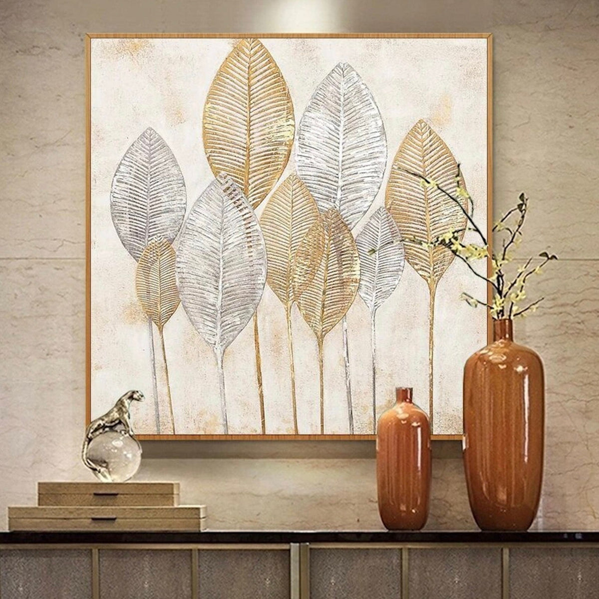Room mockup. Tall gold-coloured and silver-grey leaf skeletons on fine stems against a pale cream textured background.