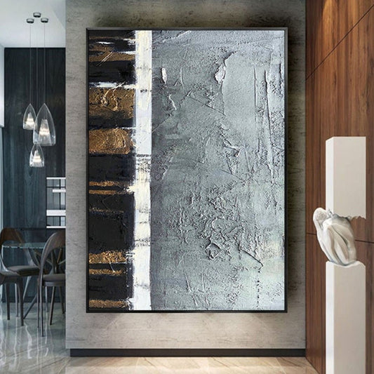 Room mockup. A broad cracked grey textured field beside a narrow black strip crossed by short gold-coloured bars and a white divider.