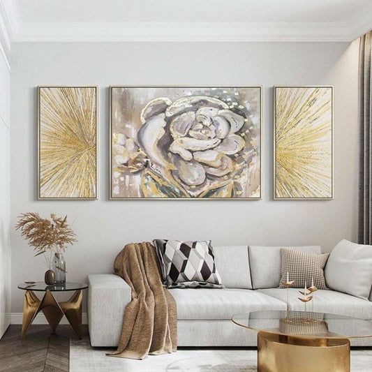 Room mockup. A central grey and white flower panel flanked by two narrow panels of radiating gold-coloured lines.