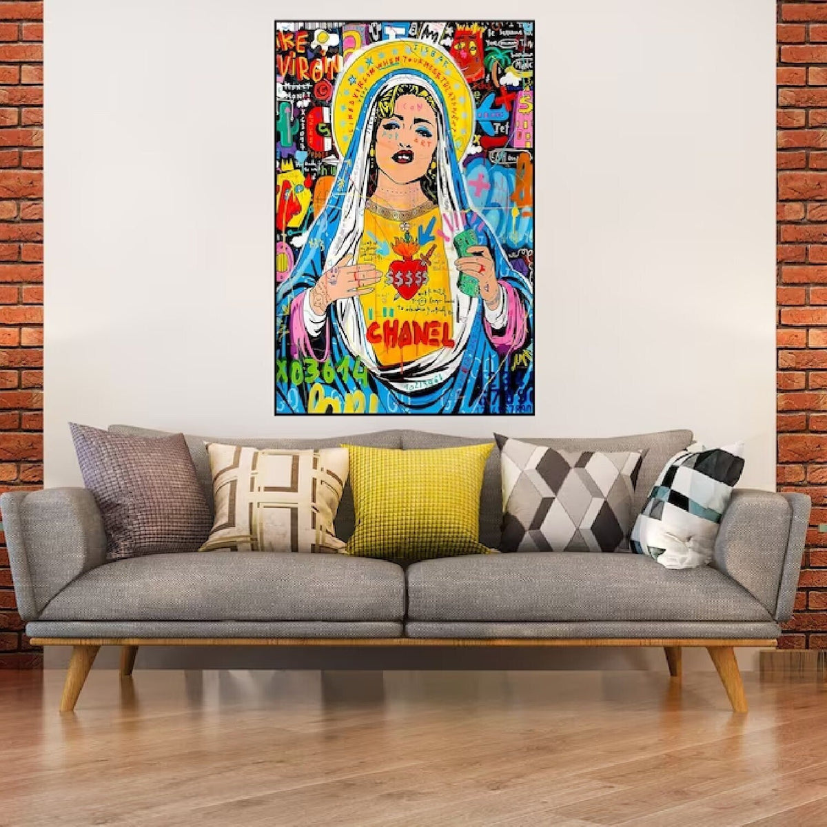Room mockup. A haloed woman with a blue and pink veil and bright yellow chest panel amid colourful graffiti lettering.