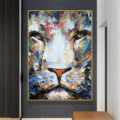Room mockup. Close frontal lion face built from blue, white, ochre and orange strokes, with golden eyes and a dark muzzle.