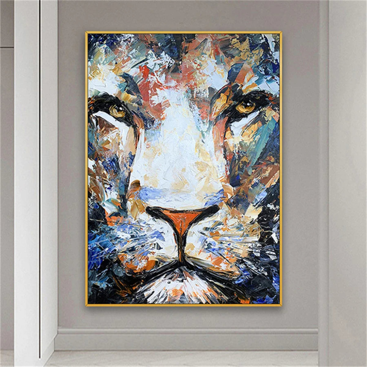 Room mockup. Close frontal lion face built from blue, white, ochre and orange strokes, with golden eyes and a dark muzzle.