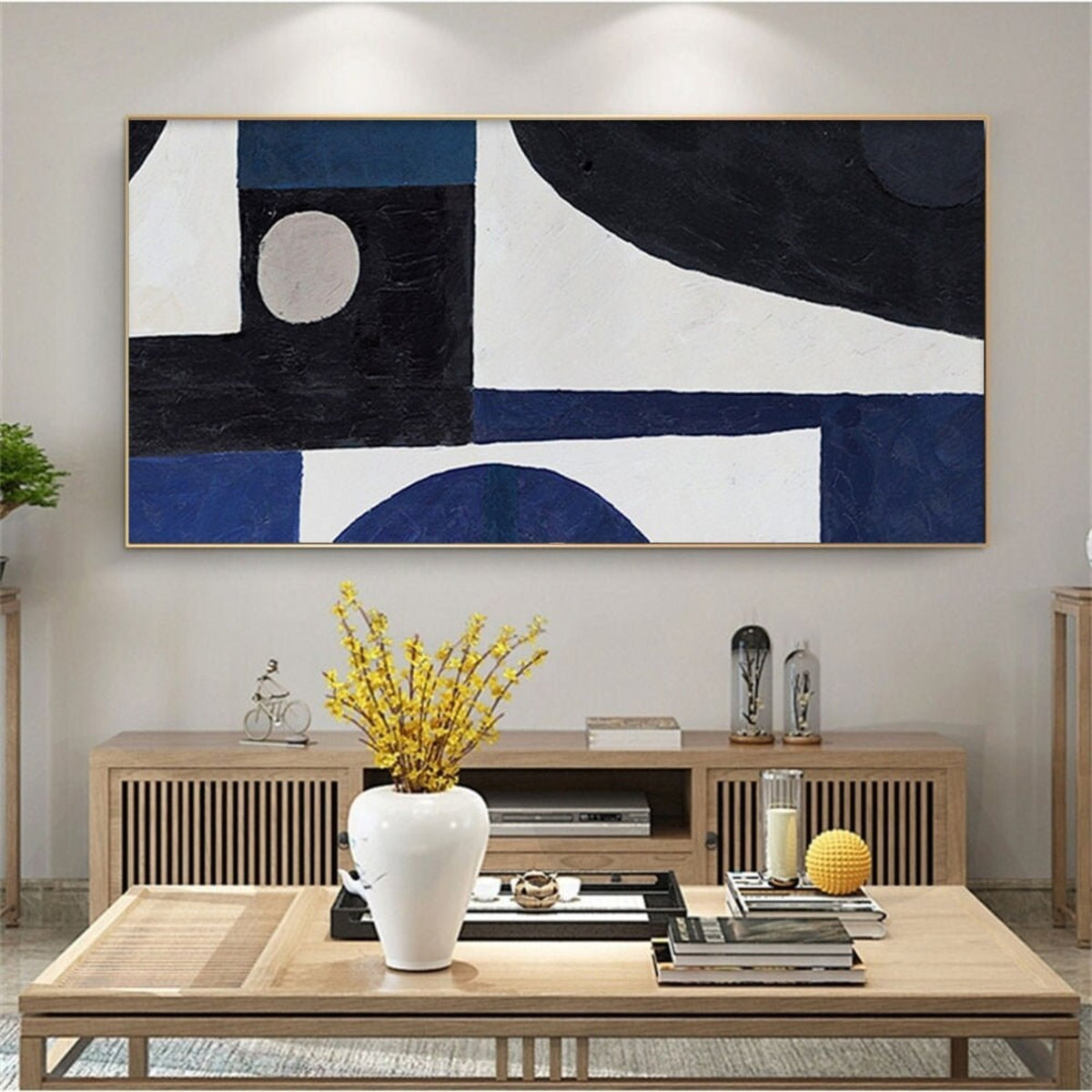 Room mockup. Black and navy blocks, a small pale circle and broad curved white fields form a bold geometric composition.